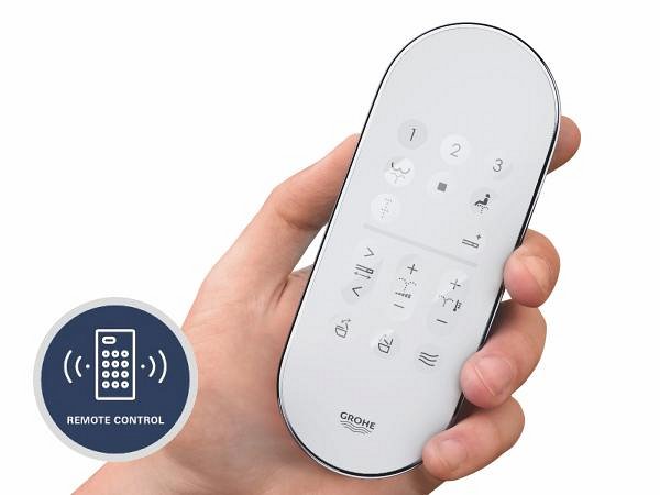 A person holding the GROHE Sensia Pro remote control.