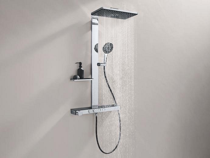 Close-up of the Rainshower Aqua Pure Shower System featuring the large, square shower head design in Chrome and black glass with water flowing from it.