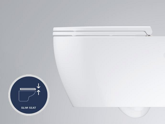A close-up of a sleek, minimalistic white toilet with a slim seat, showcasing the Slim Seat feature that enhances space efficiency.