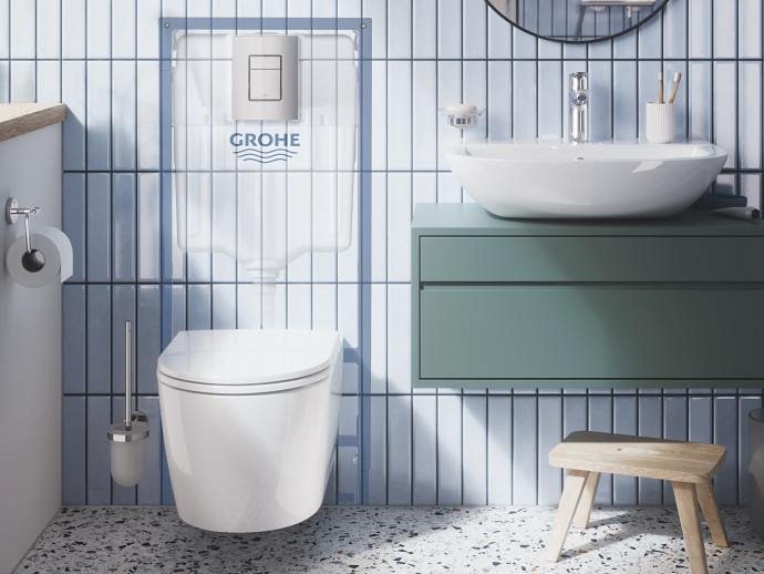 A modern bathroom featuring a wall-mounted toilet bundled with a frame and a sleek flush plate.
