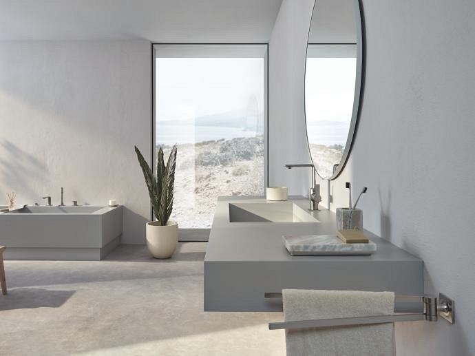 Spaciously designed bathroom with grey fittings, elegant satin steel GROHE taps, and abundant natural light.