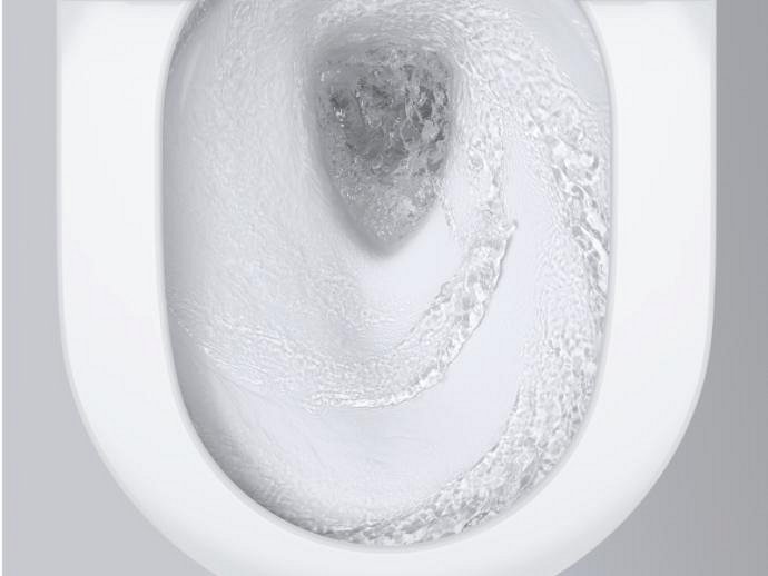 A close-up of a GROHE Sensia shower toilet being flushed.