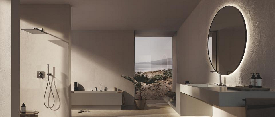  GROHE Satin Graphite faucet in dark grey on neutral tones of beige fabric, taupe tiles, and natural stone - refined and minimalistic.